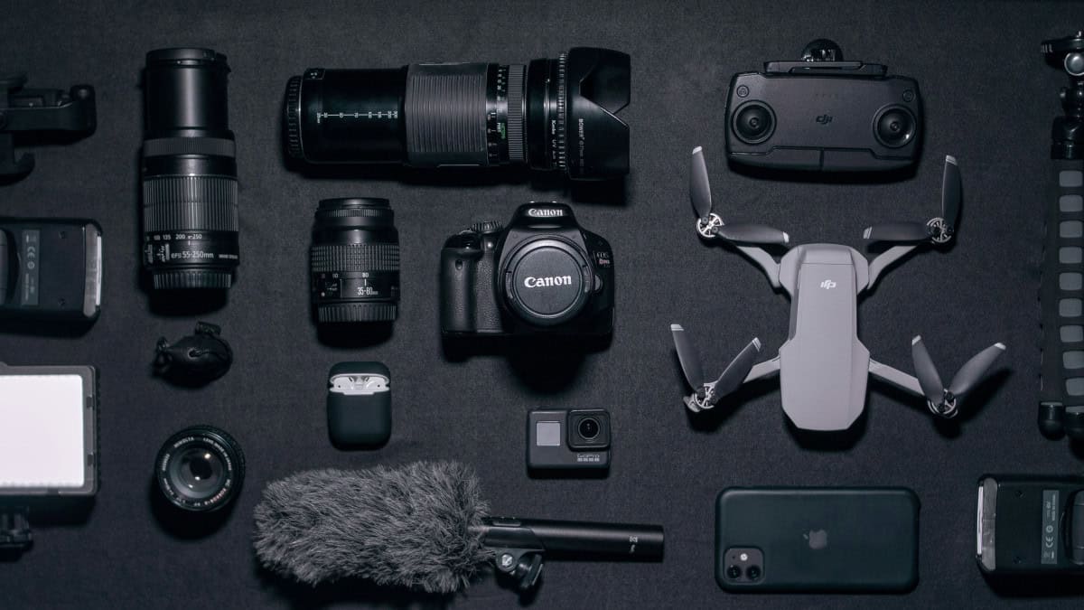 photographic equipment black camera drone cell phone flash tripie airpods lenses