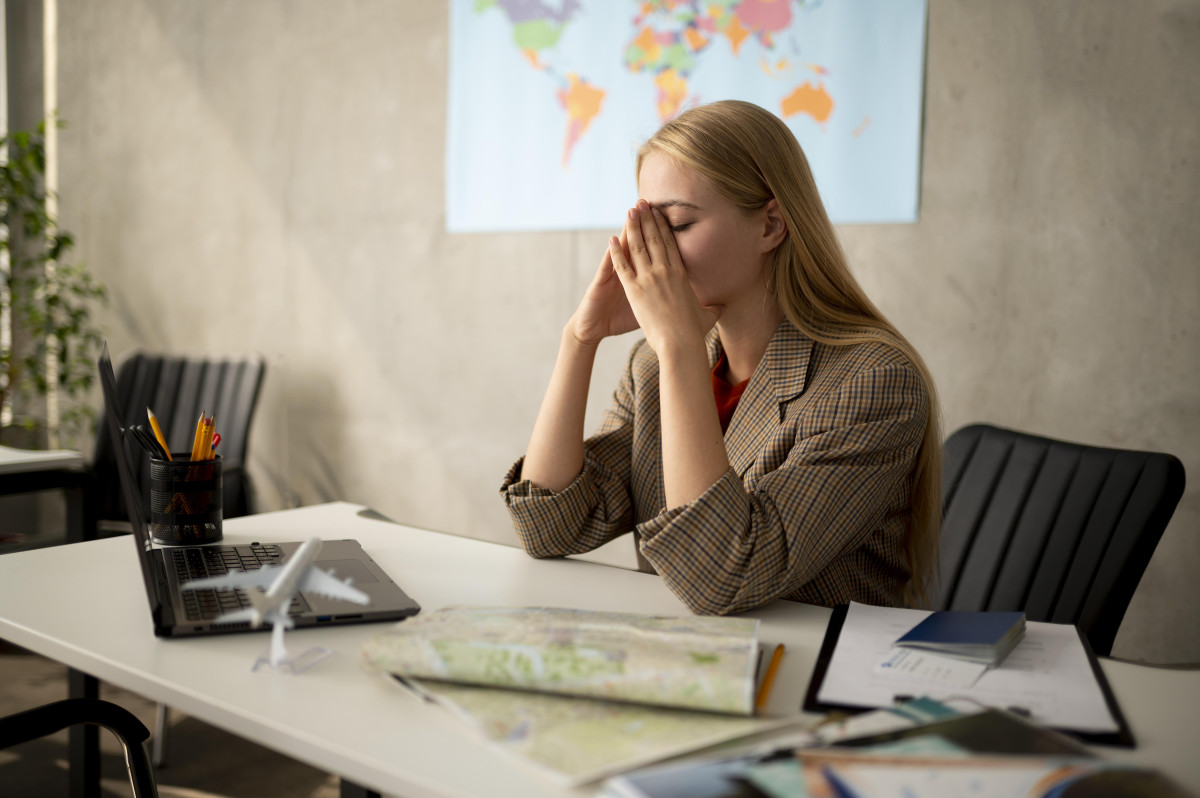 medium shot sad woman travel agency