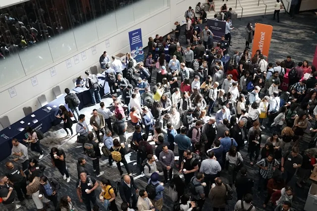 crowd of people in building lobby
