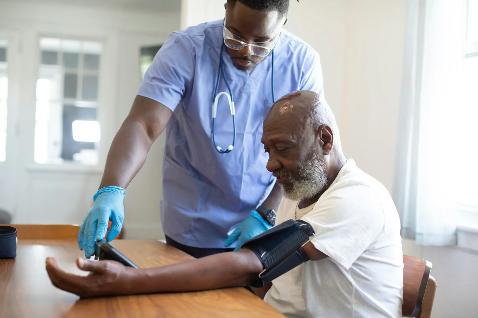 A man showing a man something on the tablet